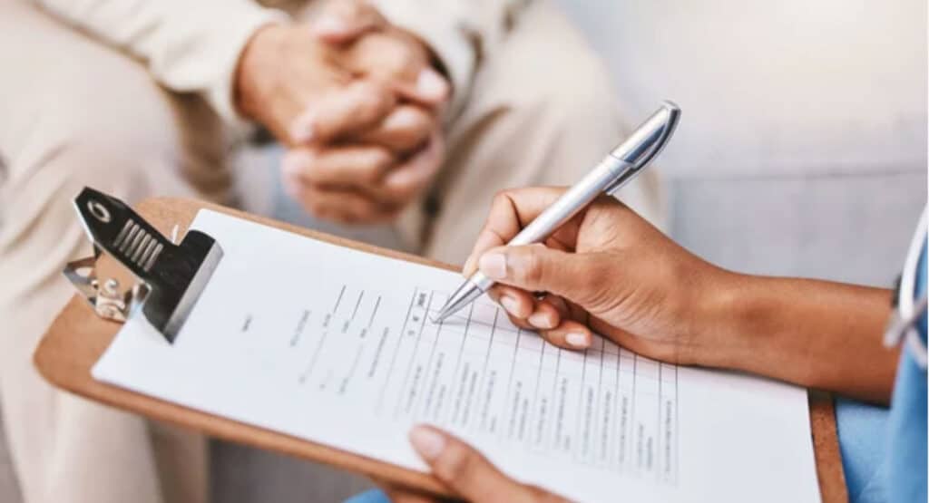 Nurse, clipboard and pen for checklist with patient, healthcare service and medical information. Closeup doctor hands writing documents, research and questions for report