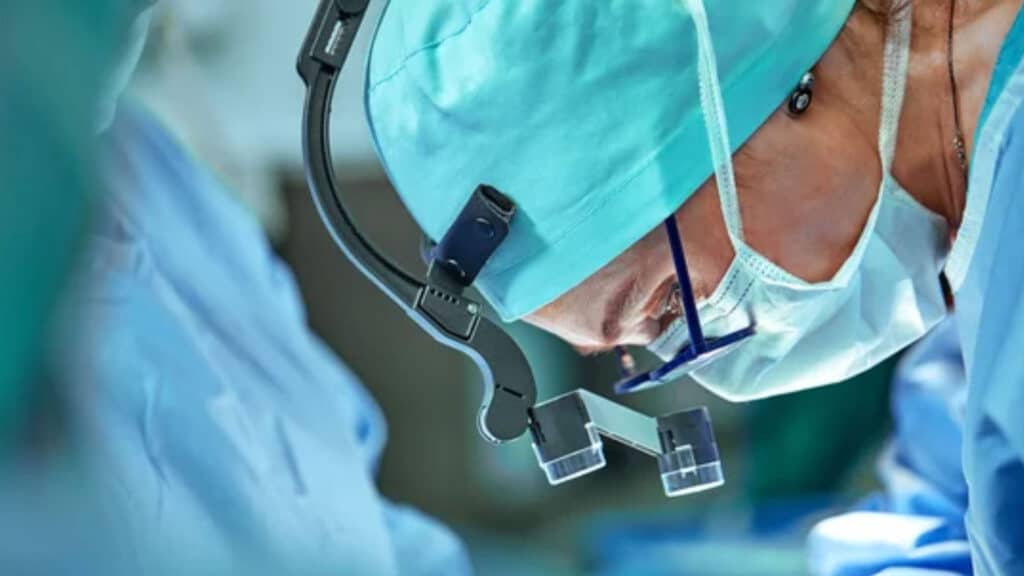 Female surgeon in operation room with reflection in glasses